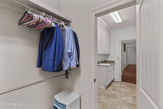 125 Rhodes Ln, Canton, MS 39046 - walk in closet featuring a sink and stone finish floors