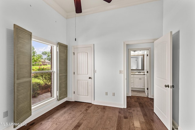 125 Rhodes Ln, Canton, MS 39046 - unfurnished bedroom featuring wood finished floors, baseboards, a towering ceiling, ceiling fan, and a sink