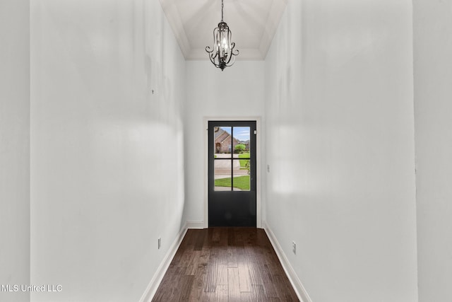 125 Rhodes Ln, Canton, MS 39046 - doorway with a chandelier, dark wood finished floors, baseboards, a high ceiling, and crown molding