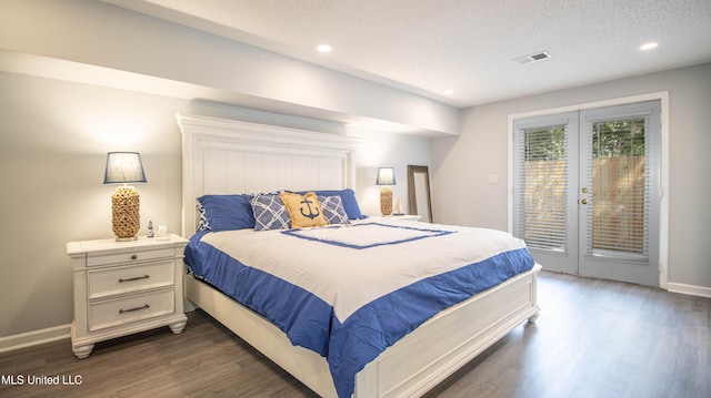 bedroom featuring access to exterior, dark hardwood / wood-style floors, and a textured ceiling