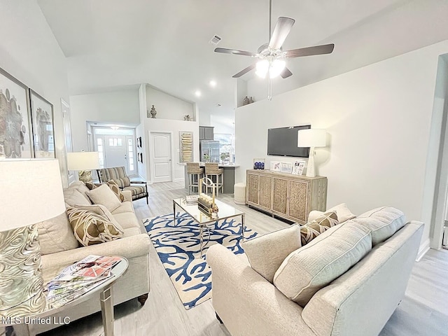 14007 Plantation Oaks Dr, Gulfport, MS 39503 - living room featuring high vaulted ceiling, a ceiling fan, and light wood-type flooring