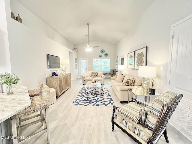 14007 Plantation Oaks Dr, Gulfport, MS 39503 - living room featuring vaulted ceiling, ceiling fan, and light wood-type flooring