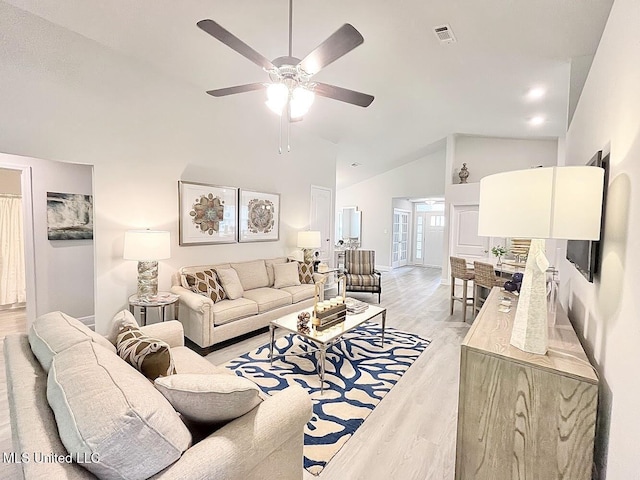 14007 Plantation Oaks Dr, Gulfport, MS 39503 - living area with light wood finished floors, ceiling fan, baseboards, and high vaulted ceiling