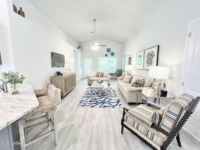 14007 Plantation Oaks Dr, Gulfport, MS 39503 - living room with lofted ceiling, light wood-style floors, and a ceiling fan