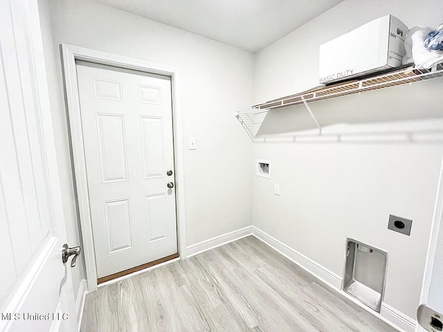 14007 Plantation Oaks Dr, Gulfport, MS 39503 - washroom with hookup for an electric dryer, light wood finished floors, hookup for a washing machine, and baseboards