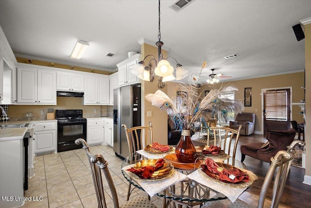 602 Oakview Way, Byram, MS 39272 - kitchen with black electric range oven, stainless steel refrigerator with ice dispenser, exhaust hood, ornamental molding, and light countertops