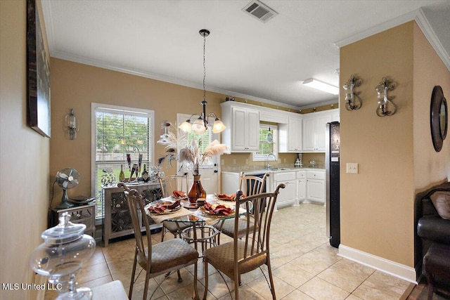 602 Oakview Way, Byram, MS 39272 - dining room featuring light tile patterned flooring, ornamental molding, baseboards, and a chandelier