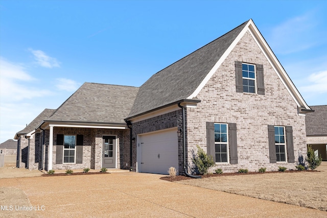 1644 Ryker Rd, Southaven, MS 38672 - view of front of home featuring brick siding, driveway, a shingled roof, and a garage