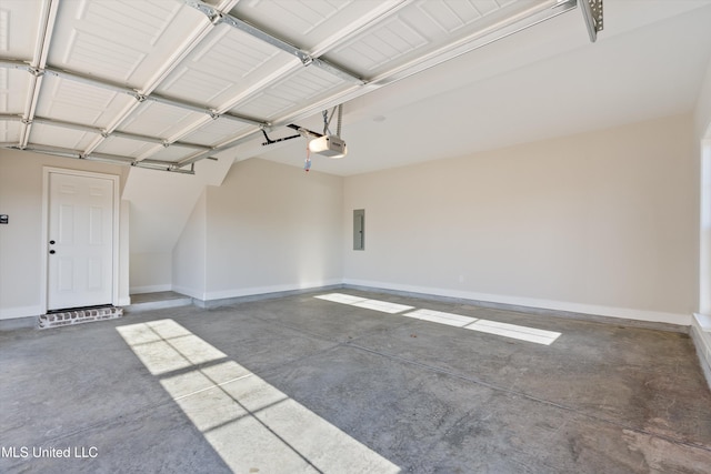 garage with a garage door opener, electric panel, and baseboards