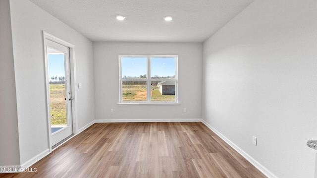 9613 Reserve Blvd, Biloxi, MS 39532 - unfurnished room with wood finished floors and recessed lighting