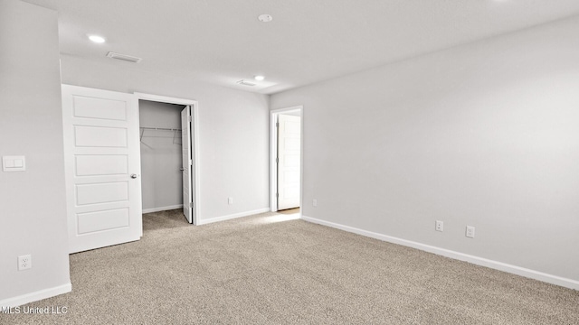 9613 Reserve Blvd, Biloxi, MS 39532 - unfurnished bedroom featuring carpet flooring, a walk in closet, recessed lighting, and a closet