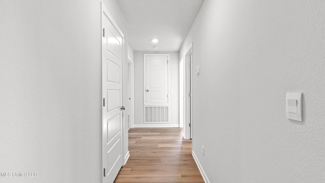 9613 Reserve Blvd, Biloxi, MS 39532 - corridor with wood finished floors and recessed lighting
