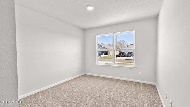 9613 Reserve Blvd, Biloxi, MS 39532 - unfurnished room featuring carpet flooring and a textured ceiling