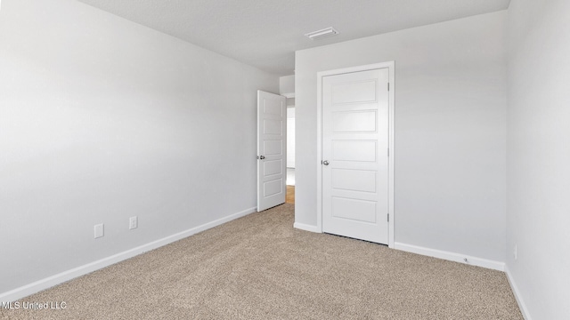 9613 Reserve Blvd, Biloxi, MS 39532 - carpeted spare room featuring baseboards