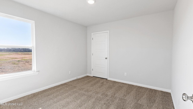 9613 Reserve Blvd, Biloxi, MS 39532 - empty room featuring plenty of natural light and carpet