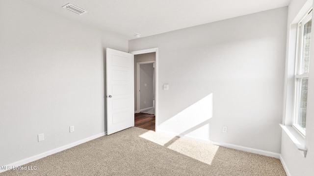 9613 Reserve Blvd, Biloxi, MS 39532 - spare room featuring carpet floors and healthy amount of natural light