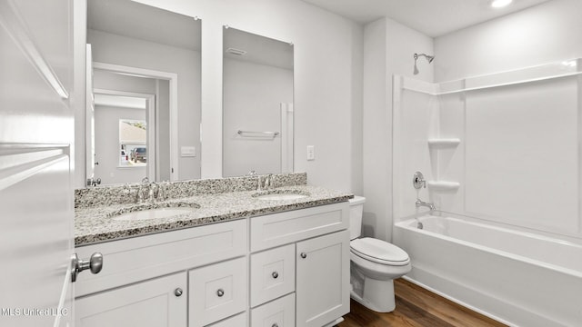 9613 Reserve Blvd, Biloxi, MS 39532 - bathroom featuring wood finished floors, double vanity, and bathtub / shower combination