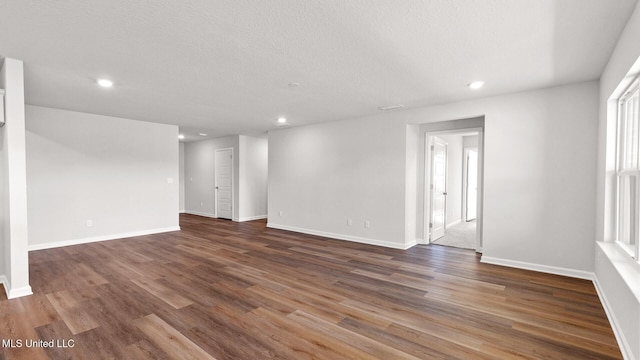 9613 Reserve Blvd, Biloxi, MS 39532 - empty room featuring recessed lighting, wood finished floors, and a textured ceiling