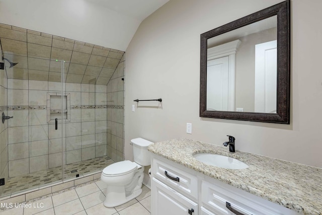 11281 Rd 468, Philadelphia, MS 39350 - bathroom featuring vaulted ceiling, tile patterned flooring, vanity, an enclosed shower, and toilet
