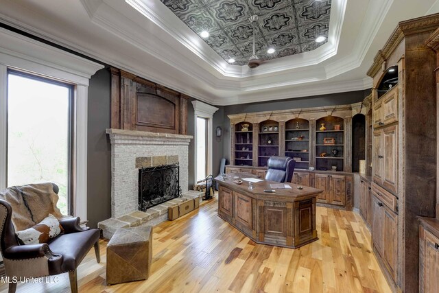 11281 Rd 468, Philadelphia, MS 39350 - office area featuring a tray ceiling, a wealth of natural light, and light wood-type flooring