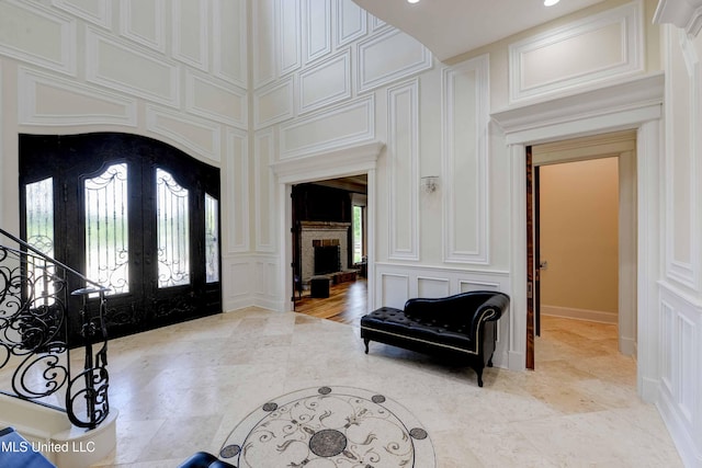 11281 Rd 468, Philadelphia, MS 39350 - entryway with french doors and a brick fireplace