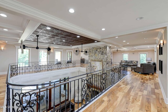 11281 Rd 468, Philadelphia, MS 39350 - hall featuring beamed ceiling, ornamental molding, and light hardwood / wood-style flooring