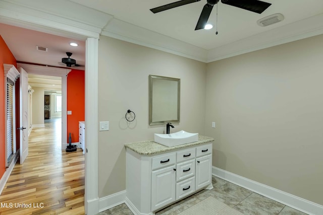 11281 Rd 468, Philadelphia, MS 39350 - bathroom featuring ornamental molding, hardwood / wood-style floors, vanity, and ceiling fan