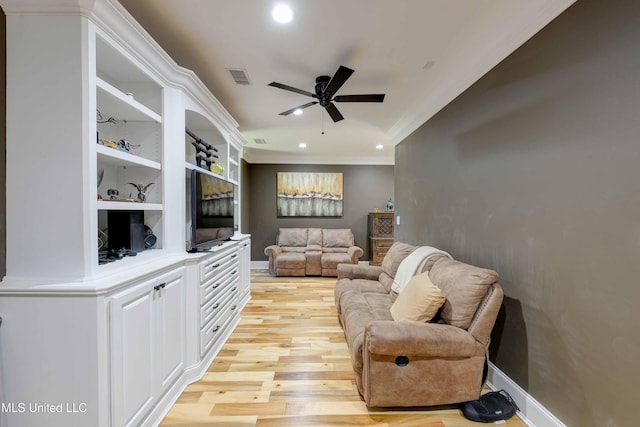 11281 Rd 468, Philadelphia, MS 39350 - living room featuring crown molding, ceiling fan, built in shelves, and light hardwood / wood-style floors