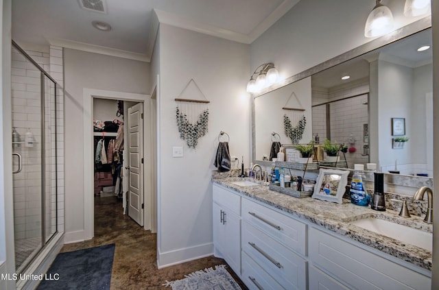 bathroom featuring ornamental molding, a stall shower, and a sink