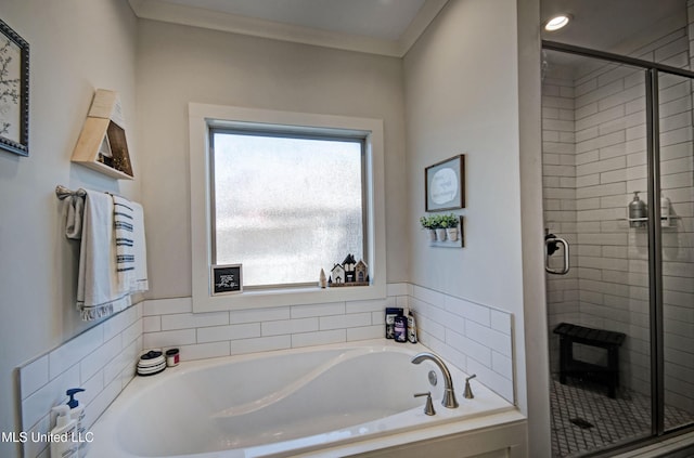 full bath with a stall shower, a bath, and crown molding