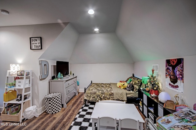 bedroom featuring vaulted ceiling and wood finished floors