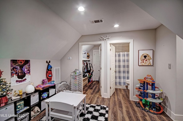 rec room with vaulted ceiling, wood finished floors, visible vents, and recessed lighting