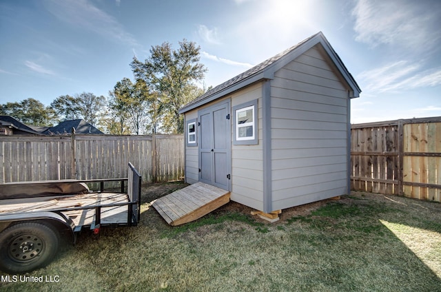 view of shed with a fenced backyard