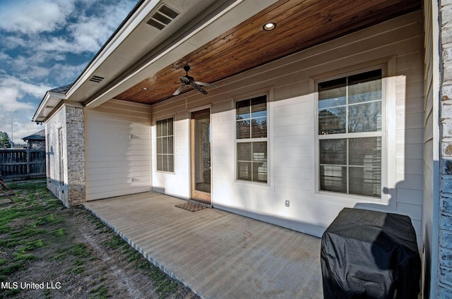 view of patio / terrace with ceiling fan, fence, and grilling area