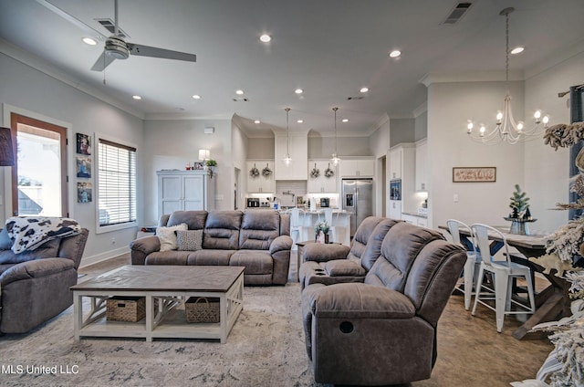 living room featuring recessed lighting, baseboards, visible vents, crown molding, and ceiling fan with notable chandelier