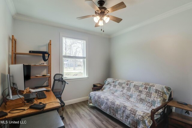 office space with a ceiling fan, wood finished floors, baseboards, and ornamental molding