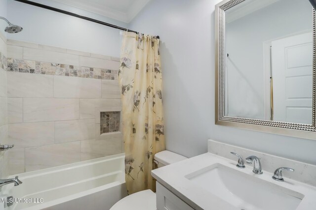 full bathroom featuring vanity, toilet, and shower / tub combo with curtain