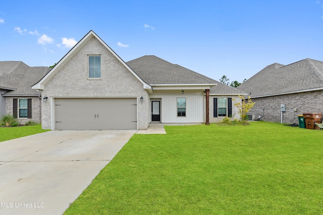 view of front of home featuring a garage, a front lawn, and central air condition unit