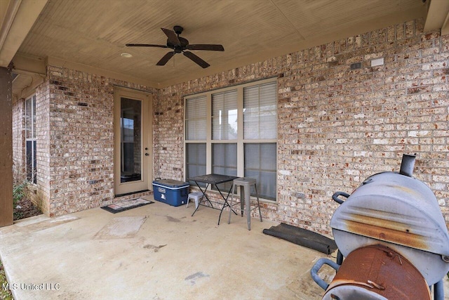 view of patio featuring ceiling fan