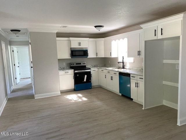 kitchen with crown molding, dishwasher, stainless steel range with electric cooktop, baseboards, and white cabinetry