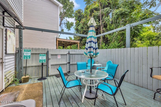 1130 Century Oaks Dr Unit B, Gulfport, MS 39507 - wooden terrace with outdoor dining space