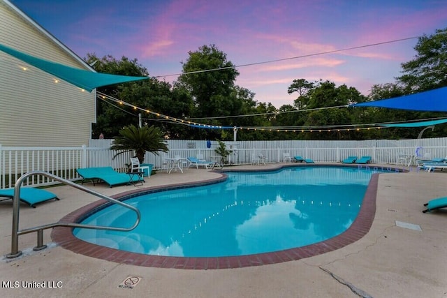 1130 Century Oaks Dr Unit B, Gulfport, MS 39507 - pool at dusk featuring a fenced backyard and a patio