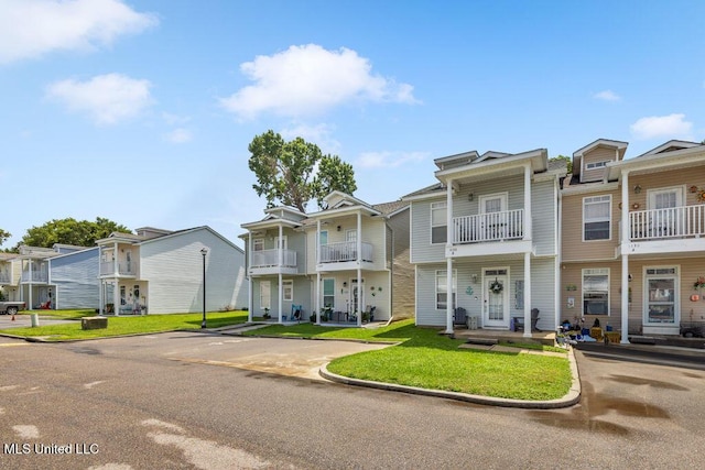 1130 Century Oaks Dr Unit B, Gulfport, MS 39507 - view of property with a residential view, uncovered parking, and a front lawn