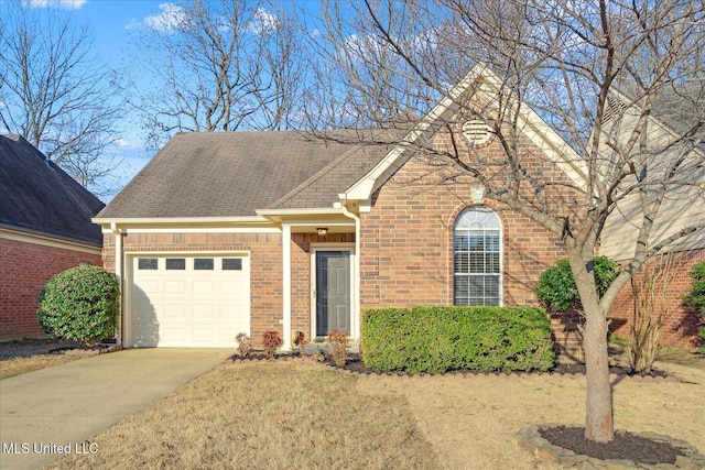 view of front of house with a garage, driveway, brick siding, and roof with shingles