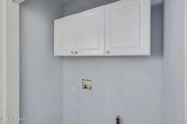 washroom with cabinet space and hookup for a washing machine