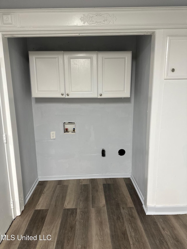 washroom featuring hookup for a washing machine, dark wood finished floors, baseboards, and cabinet space
