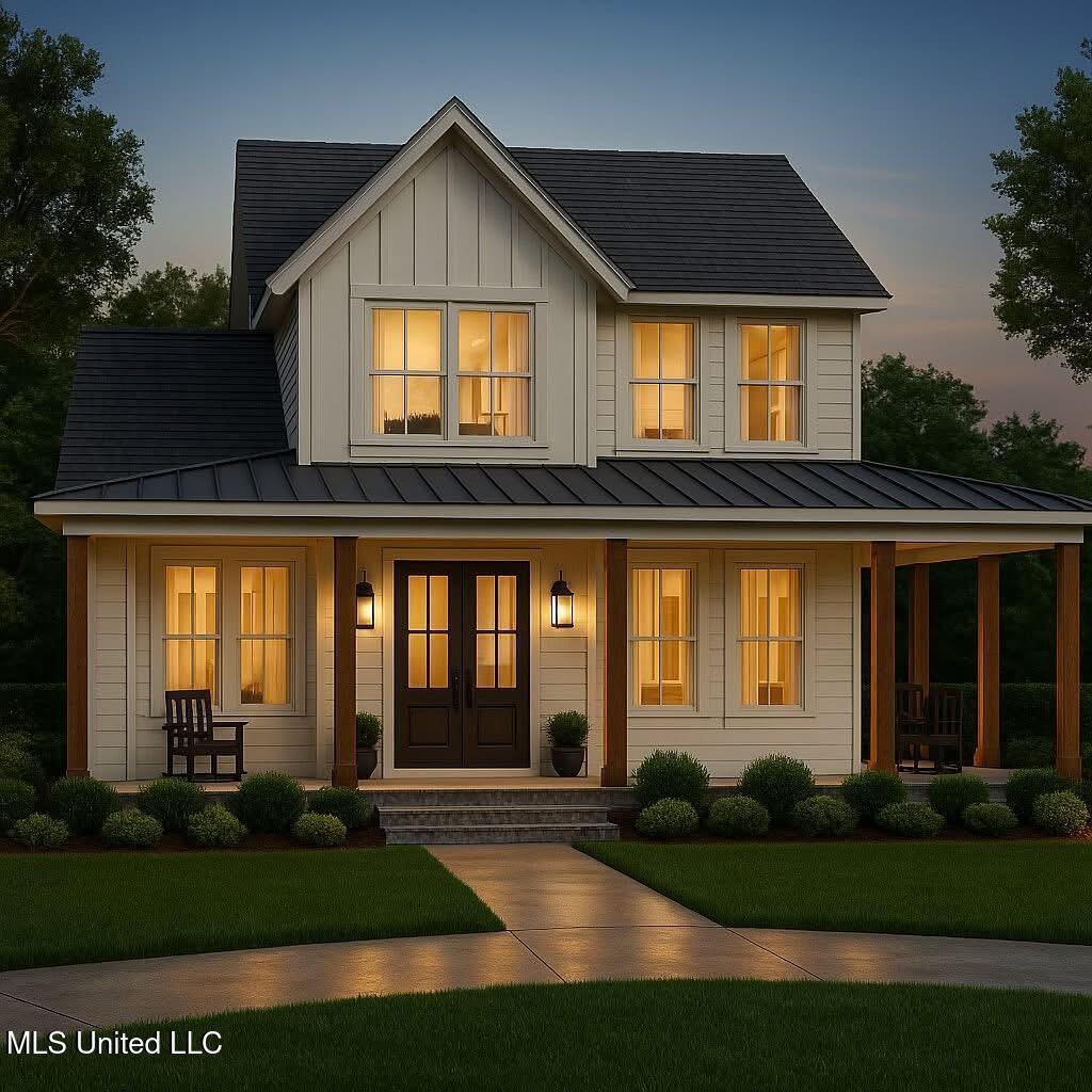 800 Arbor Pt, Brandon, MS 39047 - view of front of house featuring a yard, board and batten siding, a standing seam roof, metal roof, and covered porch