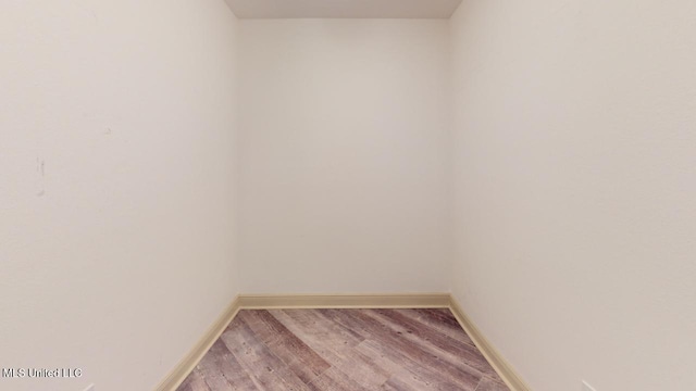 spare room featuring hardwood / wood-style flooring