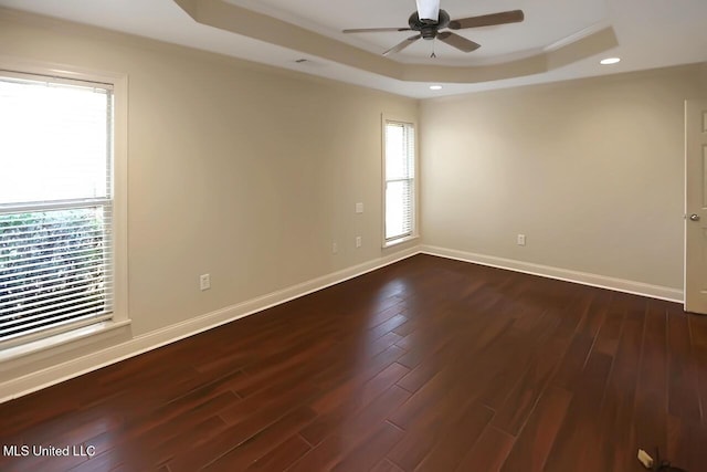 503 W Abbey Pl, Brandon, MS 39047 - unfurnished room featuring a tray ceiling, dark wood-type flooring, ceiling fan, and recessed lighting