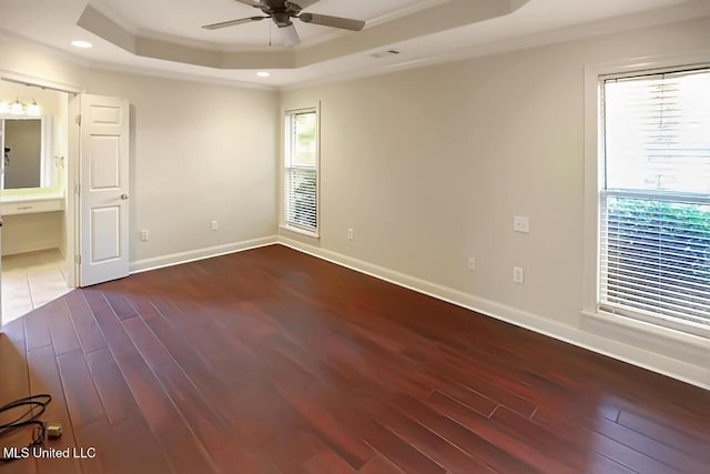 503 W Abbey Pl, Brandon, MS 39047 - spare room with a tray ceiling, a ceiling fan, wood finished floors, plenty of natural light, and ornamental molding